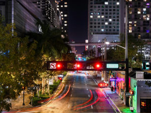 Traffic lights on an empty street at night