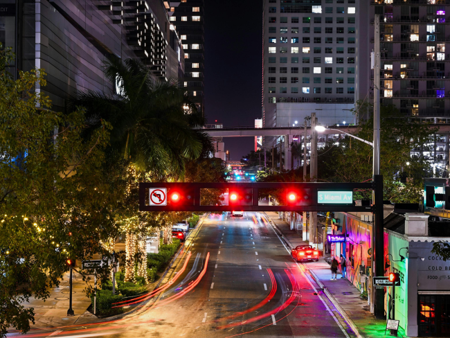 Traffic lights on an empty street at night