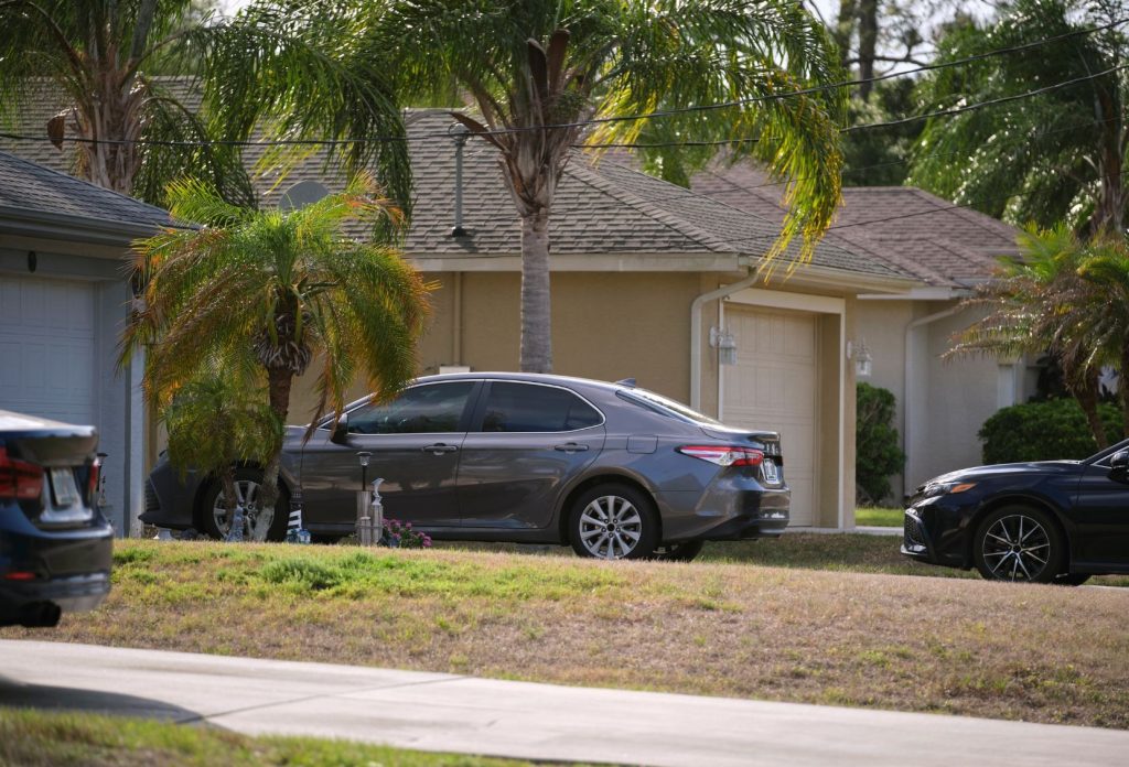 Car parked in the driveway of a Florida home